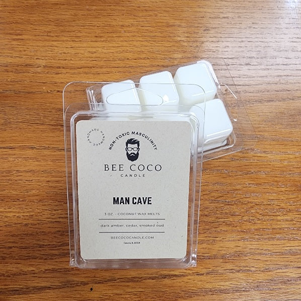 Bee Coco candle wax melts in packaging on a wooden surface