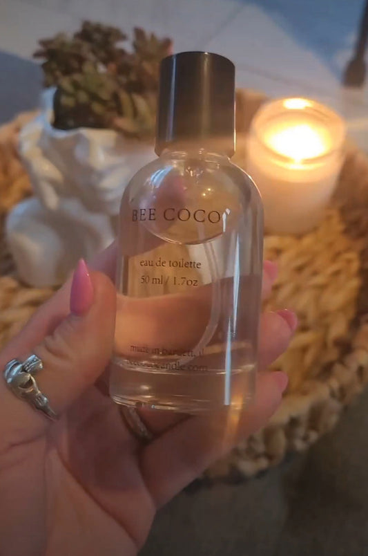 Bee Coco Candle dupe Eau de Toilette being held in a womans hand