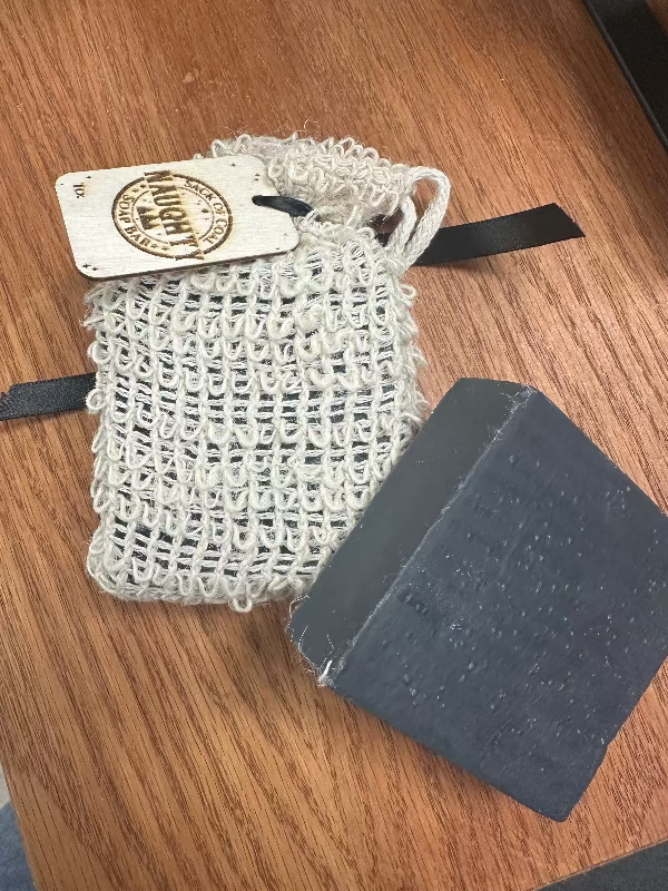 Charcoal soap placed next to Lump of Coal product