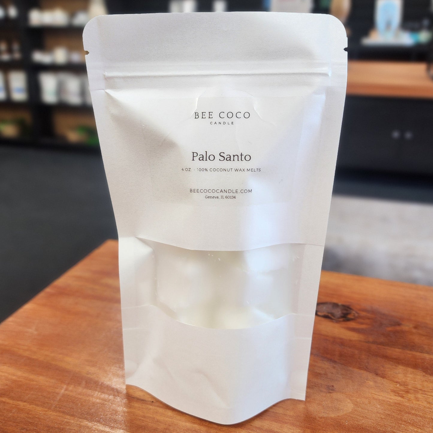 White product packaging on a wooden surface with a blurred background