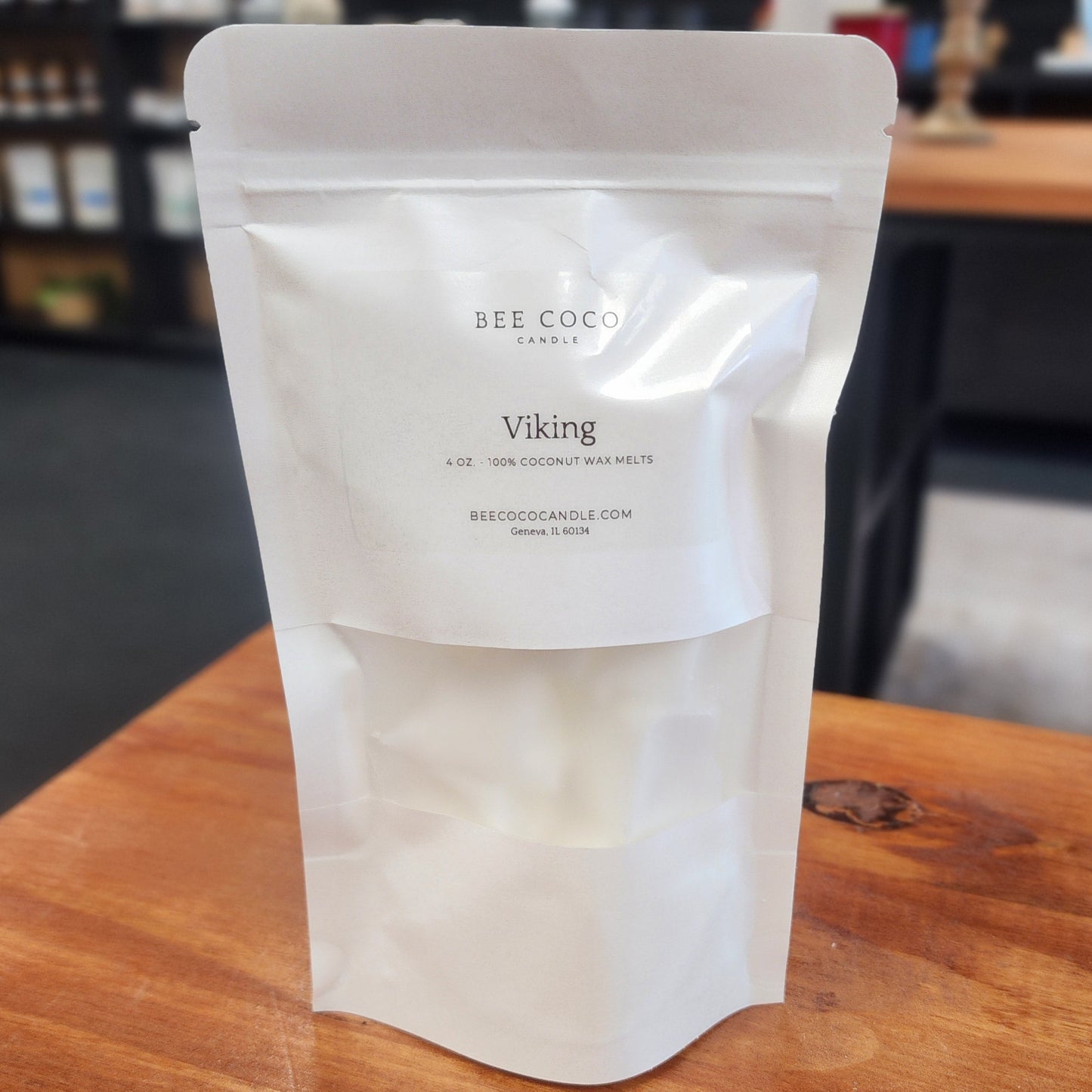 White packaging of 'Bee Coco' Viking product on a wooden surface