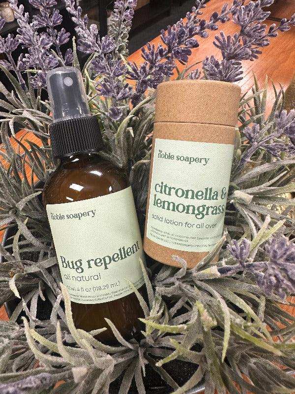 Two bottles of Zoble Soapery products on a background with lavender and eucalyptus leaves.