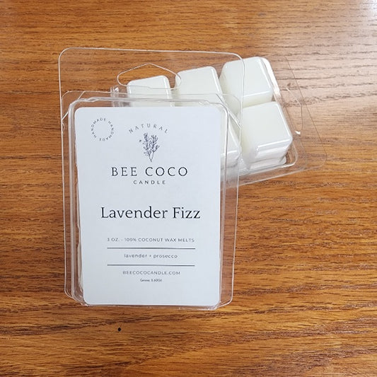 Bee Coco Lavender Fizz wax melts packaging on a wooden surface