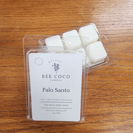 Pack of Bee Coco Palo Santo wax melts on a wooden surface