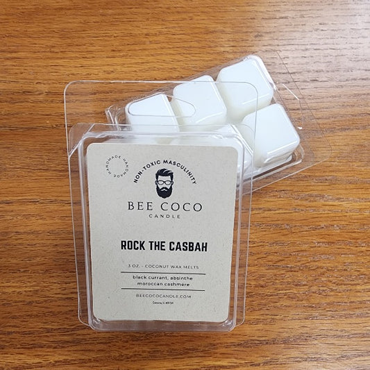 Bee Coco Candle wax melts in packaging on a wooden surface