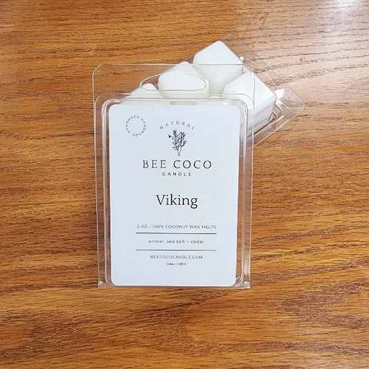 Bee Coco Candle wax melts in packaging on a wooden surface