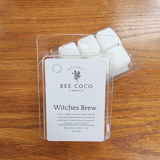 Bee Coco Candle Witches Brew wax melts in clear packaging on a wooden surface