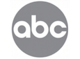 A circular gray logo with the lowercase letters 'abc' in white, centered on a black background.