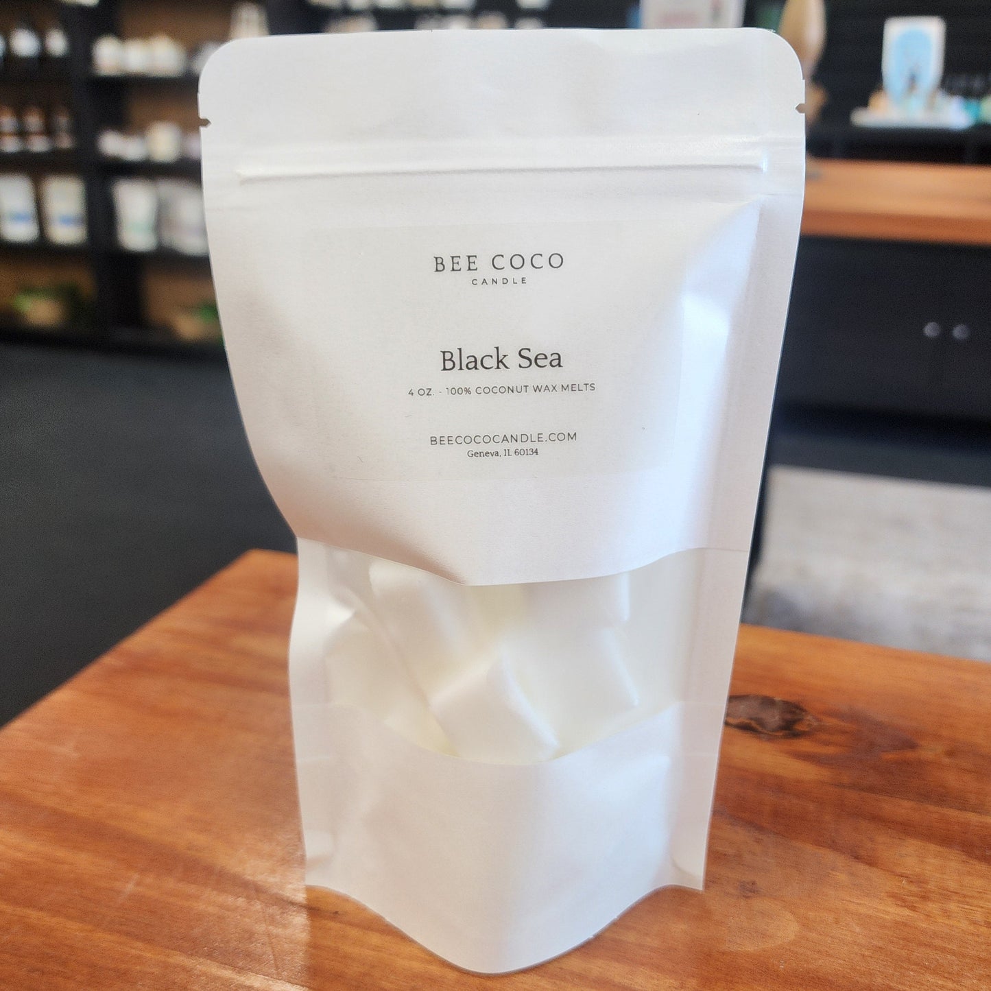 White product packaging with text on a wooden surface