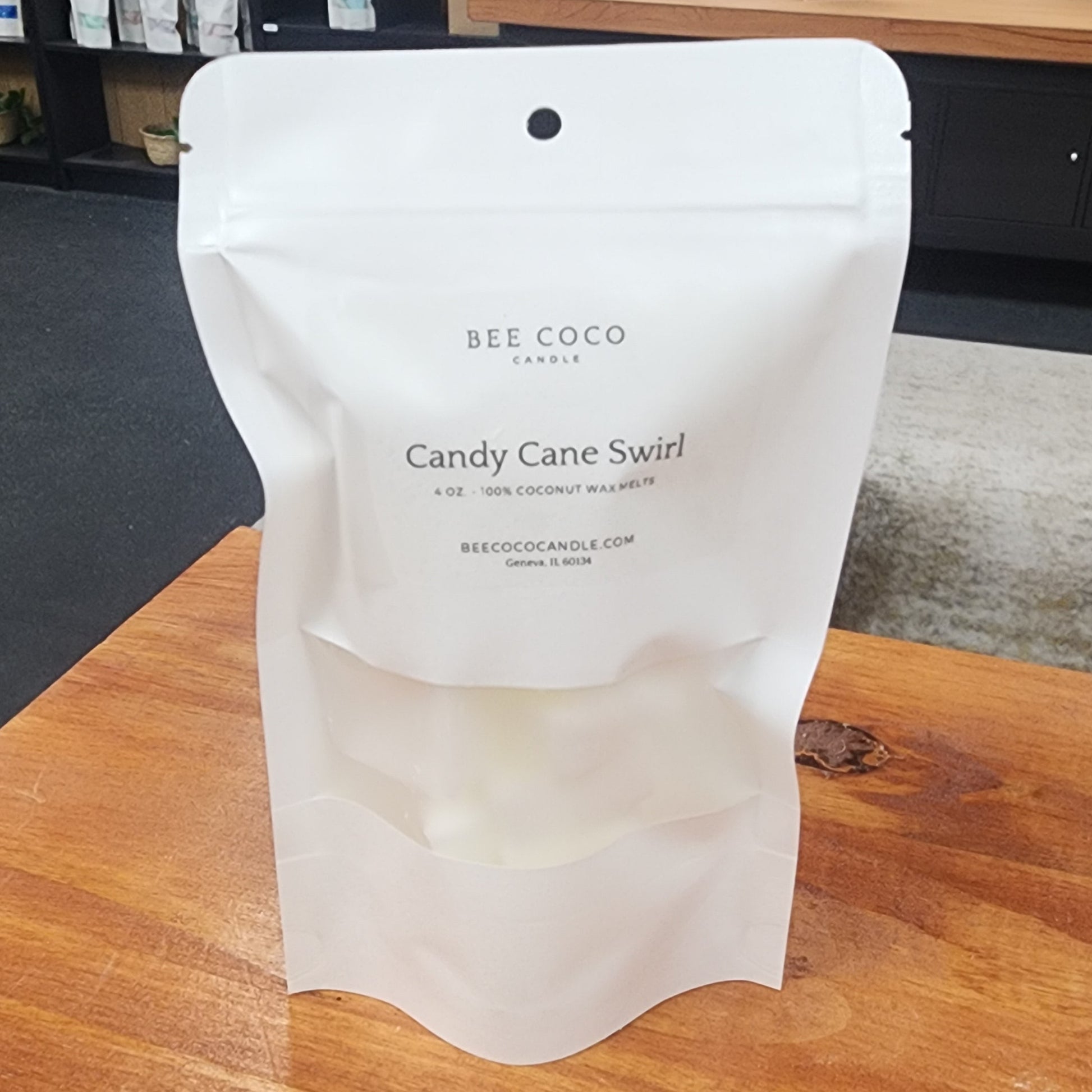 White product packaging on a wooden surface with a blurred background