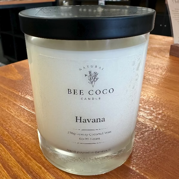 Bee Coco Havana candle on a wooden surface