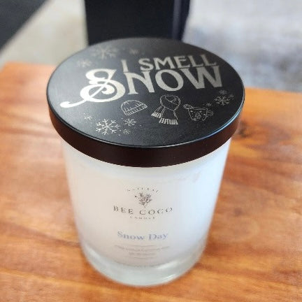 Candle with a decorative lid on a wooden surface. Gilmore Girls reference