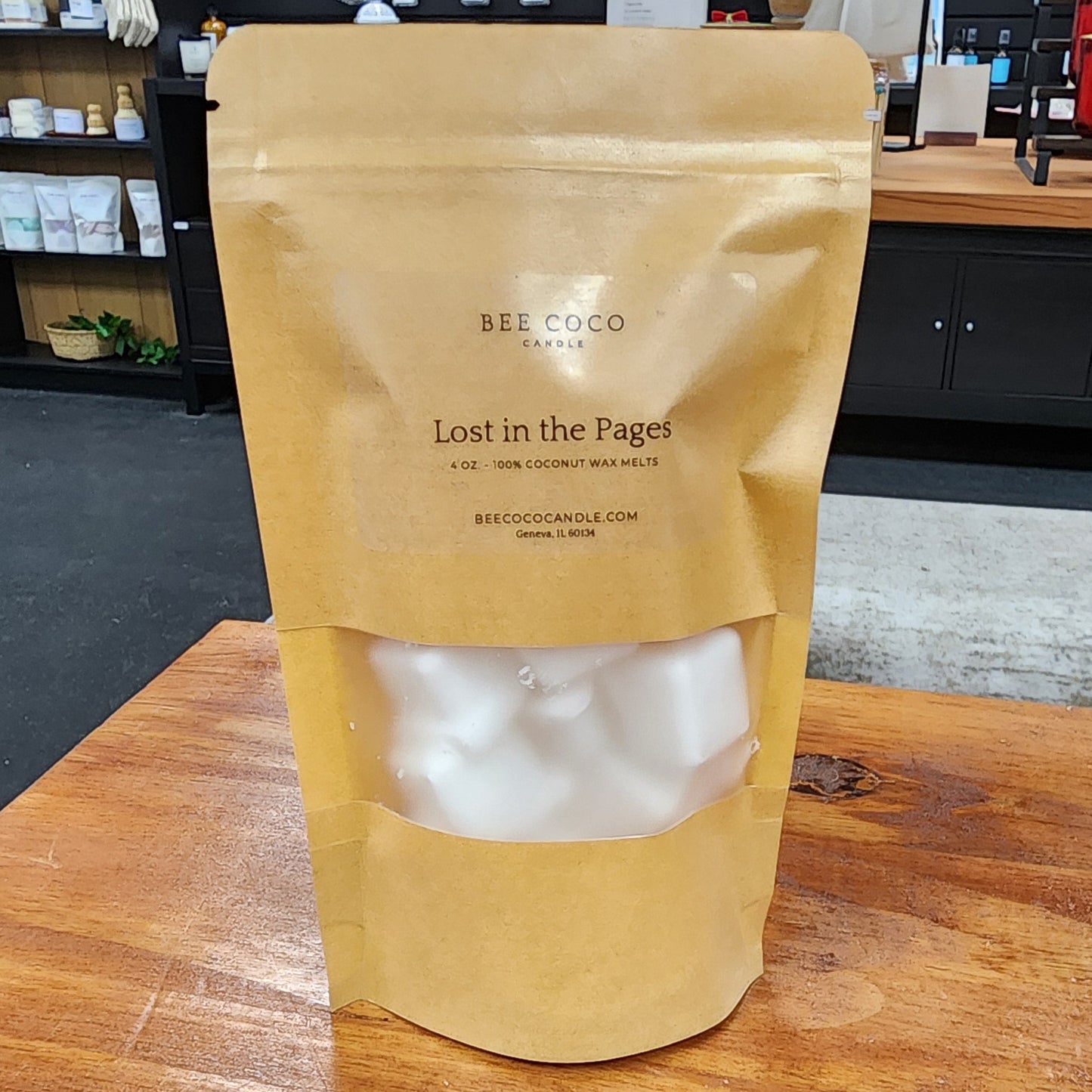 Brown paper bag with white contents on a wooden surface