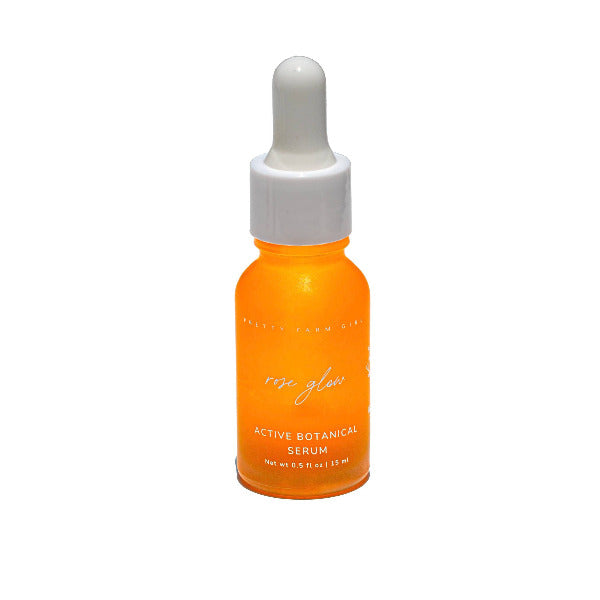 Rose Glow serum bottle with dropper on a white background