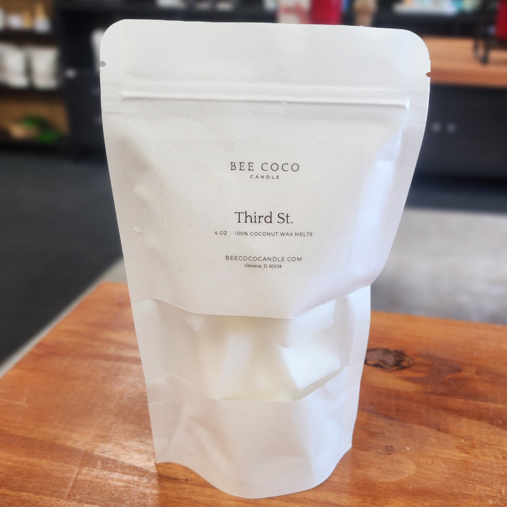 White product packaging on a wooden surface with blurred background