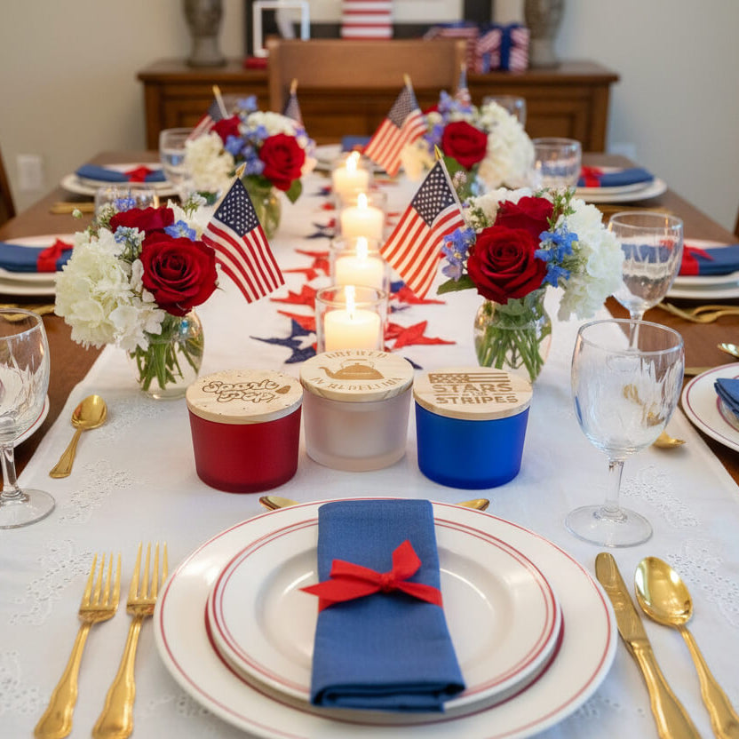 Dining table set for a celebration with red, white, and blue decorations and No Kings candles
