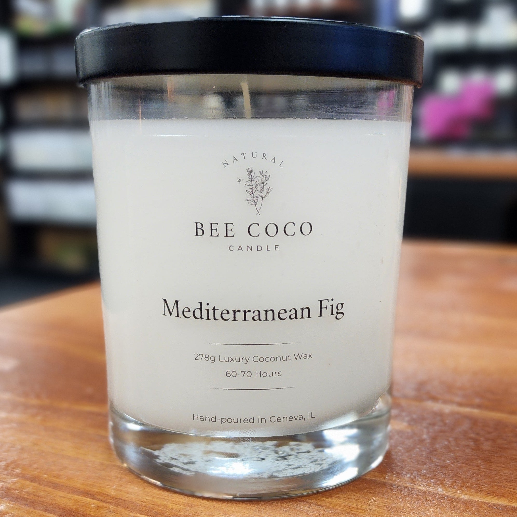 Bee & Coco candle labeled 'Mediterranean Fig' on a wooden surface